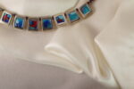 silver pendant with little pentands 4