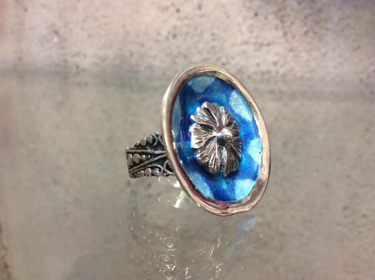 AF6E4971-D0C8-4E6D-8FCF-2180B7704DE9 Blue ring with flower - Image 1