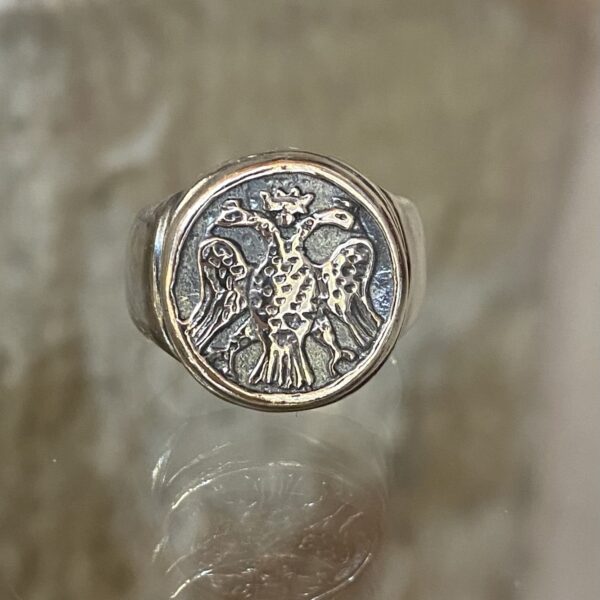 Double headed silver ring