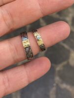 2 silver and gold rings